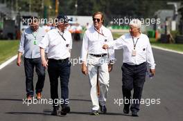 (L to R): Gary Connely (AUS) FIA Steward and CAMS with Danny Sullivan (USA) FIA Steward and Herbie Blash (GBR) FIA Delegate. 05.09.2013. Formula 1 World Championship, Rd 12, Italian Grand Prix, Monza, Italy, Preparation Day.