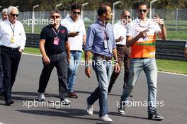Adrian Sutil (GER) Sahara Force India F1 walks the circuit with Gabriele Tarquini (ITA). 05.09.2013. Formula 1 World Championship, Rd 12, Italian Grand Prix, Monza, Italy, Preparation Day.