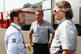 Luca Filippi (ITA) Sky Sports F1 TV Presenter (Left) with Mario Isola (ITA) Pirelli Racing Manager (Centre). 05.09.2013. Formula 1 World Championship, Rd 12, Italian Grand Prix, Monza, Italy, Preparation Day.