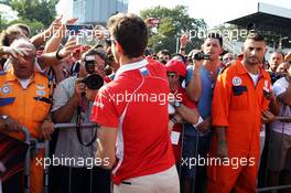 Jules Bianchi (FRA) Marussia F1 Team signs autographs for the fans. 05.09.2013. Formula 1 World Championship, Rd 12, Italian Grand Prix, Monza, Italy, Preparation Day.