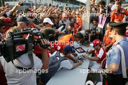 Felipe Massa (BRA) Ferrari signs autographs for the fans. 05.09.2013. Formula 1 World Championship, Rd 12, Italian Grand Prix, Monza, Italy, Preparation Day.