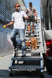 Lewis Hamilton (GBR) Mercedes AMG F1 with his dog Roscoe. 05.09.2013. Formula 1 World Championship, Rd 12, Italian Grand Prix, Monza, Italy, Preparation Day.