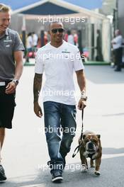 Lewis Hamilton (GBR) Mercedes AMG F1 with his dog Roscoe. 05.09.2013. Formula 1 World Championship, Rd 12, Italian Grand Prix, Monza, Italy, Preparation Day.