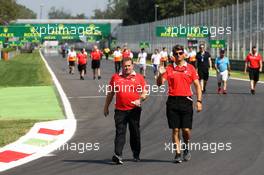 (L to R): Dave Greenwood (GBR) Marussia F1 Team Race Engineer and Graeme Lowdon (GBR) Marussia F1 Team Chief Executive Officer walk the circuit. 05.09.2013. Formula 1 World Championship, Rd 12, Italian Grand Prix, Monza, Italy, Preparation Day.