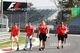 Jules Bianchi (FRA) Marussia F1 Team and Rodolfo Gonzalez (VEN) Marussia F1 Team Reserve Driver walk the circuit. 05.09.2013. Formula 1 World Championship, Rd 12, Italian Grand Prix, Monza, Italy, Preparation Day.