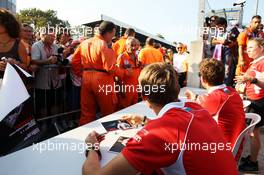 Max Chilton (GBR) Marussia F1 Team and team mate Jules Bianchi (FRA) Marussia F1 Team at the drivers autogrpah session. 05.09.2013. Formula 1 World Championship, Rd 12, Italian Grand Prix, Monza, Italy, Preparation Day.