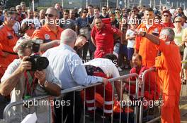 Medical attention is required at the drivers autograph signing session in the pits. 05.09.2013. Formula 1 World Championship, Rd 12, Italian Grand Prix, Monza, Italy, Preparation Day.
