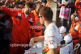 Paul di Resta (GBR) Sahara Force India F1 signs autographs for the fans. 05.09.2013. Formula 1 World Championship, Rd 12, Italian Grand Prix, Monza, Italy, Preparation Day.