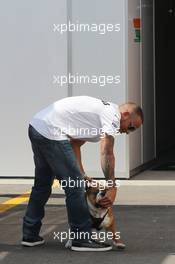 Lewis Hamilton (GBR) Mercedes AMG F1 with his dog Roscoe. 05.09.2013. Formula 1 World Championship, Rd 12, Italian Grand Prix, Monza, Italy, Preparation Day.