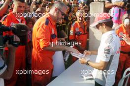 Sergio Perez (MEX) McLaren signs autographs for the fans. 05.09.2013. Formula 1 World Championship, Rd 12, Italian Grand Prix, Monza, Italy, Preparation Day.