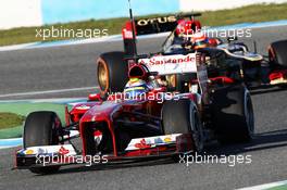 Felipe Massa (BRA) Ferrari F138 leads Romain Grosjean (FRA) Lotus F1 E21. 05.02.2013. Formula One Testing, Day One, Jerez, Spain.