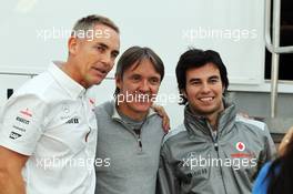 (L to R): Martin Whitmarsh (GBR) McLaren Chief Executive Officer with Adrian Fernandez (MEX) and Sergio Perez (MEX) McLaren. 05.02.2013. Formula One Testing, Day One, Jerez, Spain.