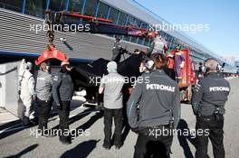 The Mercedes AMG F1 W04 of Nico Rosberg (GER) Mercedes AMG F1 is recovered back to the pits on the back of a truck. 05.02.2013. Formula One Testing, Day One, Jerez, Spain.