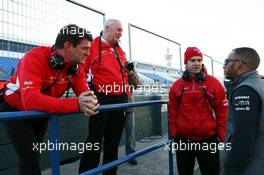 Lewis Hamilton (GBR) Mercedes AMG F1 with (L to R): Graeme Lowdon (GBR) Marussia F1 Team Chief Executive Officer, John Booth (GBR) Marussia F1 Team Team Principal and Marc Hynes (GBR) Marussia F1 Team Driver Coach. 05.02.2013. Formula One Testing, Day One, Jerez, Spain.