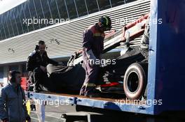 The McLaren MP4-28 is recovered back to the pits on the back of a truck. 05.02.2013. Formula One Testing, Day One, Jerez, Spain.