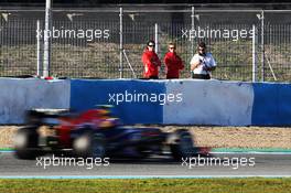 Mark Webber (AUS) Red Bull Racing RB9 is watched by Max Chilton (GBR) Marussia F1 Team, Marc Hynes (GBR) Marussia F1 Team Driver Coach and Graeme Lowdon (GBR) Marussia F1 Team Chief Executive Officer. 05.02.2013. Formula One Testing, Day One, Jerez, Spain.