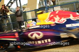 Lewis Hamilton (GBR) Mercedes AMG F1 watches Mark Webber (AUS) Red Bull Racing pass in the pits. 05.02.2013. Formula One Testing, Day One, Jerez, Spain.