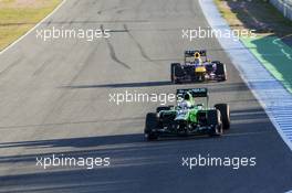 Giedo van der Garde (NLD) Caterham CT03 leads Mark Webber (AUS) Red Bull Racing RB9. 05.02.2013. Formula One Testing, Day One, Jerez, Spain.