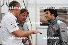 (L to R): Martin Whitmarsh (GBR) McLaren Chief Executive Officer with Adrian Fernandez (MEX) and Sergio Perez (MEX) McLaren. 05.02.2013. Formula One Testing, Day One, Jerez, Spain.