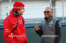 (L to R): Marc Hynes (GBR) Marussia F1 Team Driver Coach with Lewis Hamilton (GBR) Mercedes AMG F1. 05.02.2013. Formula One Testing, Day One, Jerez, Spain.