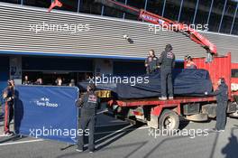 The Scuderia Toro Rosso STR8 of Daniel Ricciardo (AUS) Scuderia Toro Rosso is recovered back to the pits on the back of a truck. 06.02.2013. Formula One Testing, Day Two, Jerez, Spain.