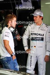 (L to R): Sam Bird (GBR) Mercedes AMG F1 Test And Reserve Driver with Nico Rosberg (GER) Mercedes AMG F1. 11.10.2013. Formula 1 World Championship, Rd 15, Japanese Grand Prix, Suzuka, Japan, Practice Day.