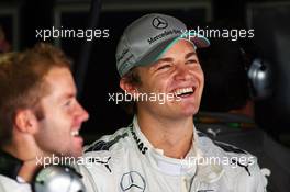 Nico Rosberg (GER) Mercedes AMG F1 with Sam Bird (GBR) Mercedes AMG F1 Test And Reserve Driver. 11.10.2013. Formula 1 World Championship, Rd 15, Japanese Grand Prix, Suzuka, Japan, Practice Day.