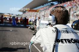 Mercedes AMG F1 mechanic on the grid. 13.10.2013. Formula 1 World Championship, Rd 15, Japanese Grand Prix, Suzuka, Japan, Race Day.