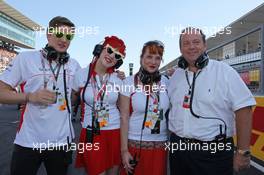 Sasha Cheglakov (RUS) Marussia Team Owner; Anya Cheglakov (RUS) and Grahame Chilton (GBR) on the grid. 13.10.2013. Formula 1 World Championship, Rd 15, Japanese Grand Prix, Suzuka, Japan, Race Day.