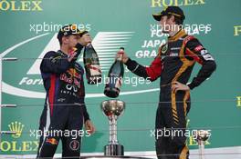 The podium (L to R): Race winner Sebastian Vettel (GER) Red Bull Racing celebrates with third placed Romain Grosjean (FRA) Lotus F1 Team. 13.10.2013. Formula 1 World Championship, Rd 15, Japanese Grand Prix, Suzuka, Japan, Race Day.