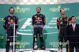The podium (L to R): Mark Webber (AUS) Red Bull Racing, second; Sebastian Vettel (GER) Red Bull Racing, race winner; Romain Grosjean (FRA) Lotus F1 Team, third. 13.10.2013. Formula 1 World Championship, Rd 15, Japanese Grand Prix, Suzuka, Japan, Race Day.