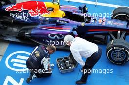Herbie Blash (GBR) FIA Delegate with the Red Bull Racing RB9 of Mark Webber (AUS) Red Bull Racing in parc ferme. 13.10.2013. Formula 1 World Championship, Rd 15, Japanese Grand Prix, Suzuka, Japan, Race Day.