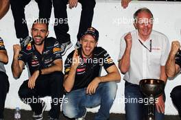 Race winner Sebastian Vettel (GER) Red Bull Racing celebrates with Dr Helmut Marko (AUT) Red Bull Motorsport Consultant (Right) and the team. 13.10.2013. Formula 1 World Championship, Rd 15, Japanese Grand Prix, Suzuka, Japan, Race Day.