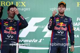 Mark Webber (AUS) Red Bull Racing and 1st place Sebastian Vettel (GER) Red Bull Racing. 13.10.2013. Formula 1 World Championship, Rd 15, Japanese Grand Prix, Suzuka, Japan, Race Day.