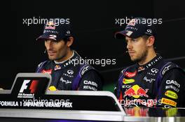 (L to R): Mark Webber (AUS) Red Bull Racing and race winner Sebastian Vettel (GER) Red Bull Racing in the FIA Press Conference. 13.10.2013. Formula 1 World Championship, Rd 15, Japanese Grand Prix, Suzuka, Japan, Race Day.