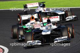 Valtteri Bottas (FIN) Williams FW35 leads Paul di Resta (GBR) Sahara Force India VJM06 and Pastor Maldonado (VEN) Williams FW35. 13.10.2013. Formula 1 World Championship, Rd 15, Japanese Grand Prix, Suzuka, Japan, Race Day.