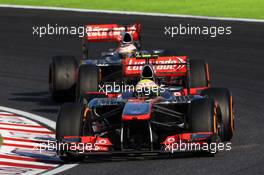Sergio Perez (MEX) McLaren MP4-28 leads team mate Jenson Button (GBR) McLaren MP4-28. 13.10.2013. Formula 1 World Championship, Rd 15, Japanese Grand Prix, Suzuka, Japan, Race Day.