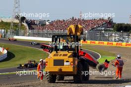 Jules Bianchi (FRA) Marussia F1 Team MR02 crashes out at the start of the race. 13.10.2013. Formula 1 World Championship, Rd 15, Japanese Grand Prix, Suzuka, Japan, Race Day.