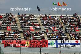 Banners for Felipe Massa (BRA) Ferrari and Kimi Raikkonen (FIN) Lotus F1 Team.