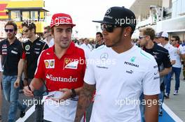 (L to R): Fernando Alonso (ESP) Ferrari and Lewis Hamilton (GBR) Mercedes AMG F1 on the drivers parade. 13.10.2013. Formula 1 World Championship, Rd 15, Japanese Grand Prix, Suzuka, Japan, Race Day.