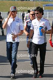 (L to R): Esteban Gutierrez (MEX) Sauber with Sergio Perez (MEX) McLaren. 13.10.2013. Formula 1 World Championship, Rd 15, Japanese Grand Prix, Suzuka, Japan, Race Day.