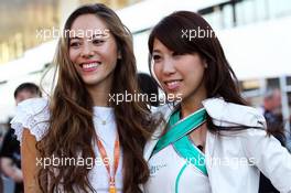 A grid girl with Jessica Michibata (JPN), girlfriend of Jenson Button (GBR) McLaren. 10.10.2013. Formula 1 World Championship, Rd 15, Japanese Grand Prix, Suzuka, Japan, Preparation Day.