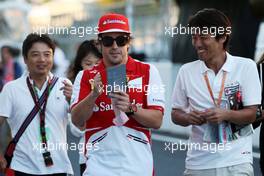 Fernando Alonso (ESP) Ferrari signs autographs for the fans. 10.10.2013. Formula 1 World Championship, Rd 15, Japanese Grand Prix, Suzuka, Japan, Preparation Day.