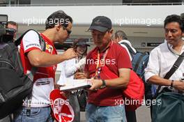 Felipe Massa (BRA) Ferrari signs autographs for the fans. 10.10.2013. Formula 1 World Championship, Rd 15, Japanese Grand Prix, Suzuka, Japan, Preparation Day.