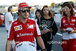 Fernando Alonso (ESP) Ferrari with girlfriend Dasha Kapustina (RUS). 10.10.2013. Formula 1 World Championship, Rd 15, Japanese Grand Prix, Suzuka, Japan, Preparation Day.