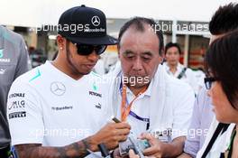 Lewis Hamilton (GBR) Mercedes AMG F1 signs autographs for the fans. 10.10.2013. Formula 1 World Championship, Rd 15, Japanese Grand Prix, Suzuka, Japan, Preparation Day.