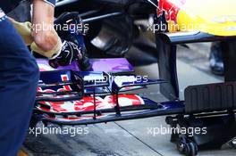 Sebastian Vettel (GER) Red Bull Racing RB9 front wing adjustment by a mechanic. 04.10.2013. Formula 1 World Championship, Rd 14, Korean Grand Prix, Yeongam, South Korea, Practice Day.