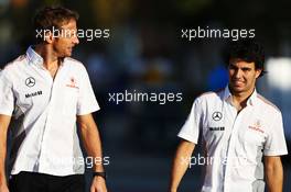 (L to R): Jenson Button (GBR) McLaren with Sergio Perez (MEX) McLaren. 04.10.2013. Formula 1 World Championship, Rd 14, Korean Grand Prix, Yeongam, South Korea, Practice Day.