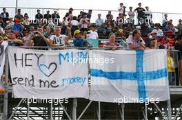 A pleading banner in the grandstand. 06.10.2013. Formula 1 World Championship, Rd 14, Korean Grand Prix, Yeongam, South Korea, Race Day.
