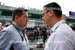 (L to R): Paul Hembery (GBR) Pirelli Motorsport Director with Jonathan Noble (GBR) Autosport Journalist on the grid. 06.10.2013. Formula 1 World Championship, Rd 14, Korean Grand Prix, Yeongam, South Korea, Race Day.